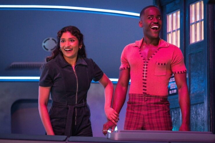 Belinda and the Doctor looking on excitedly in Doctor Who's "The Interstellar Song Contest"