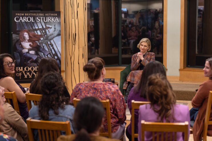 Carol Sturka at book signing for Winds of Wycaro in Pluribus